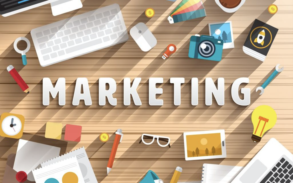 an image full of tools on a desk and in the middle the word MARKETING (all in graphic)